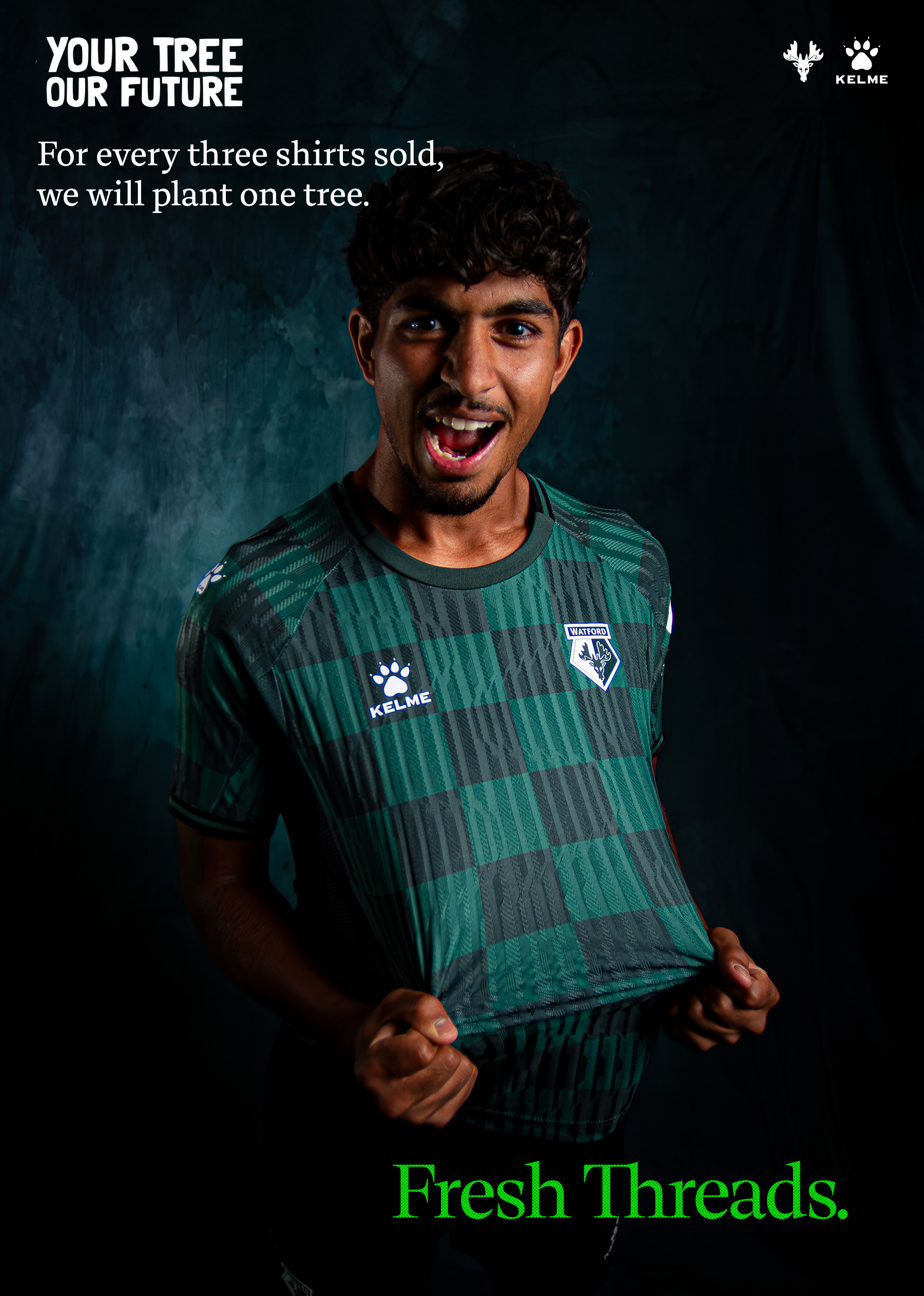 Football player, Amar Sanghrajka, wearing a green and black patterned Watford football shirt holding the bottom edges and smiling, with text about planting a tree for every three shirts sold.