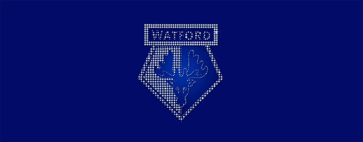 Watford emblem made of silver diamond-like dots on a dark blue background, featuring a stylized deer's head and antlers.