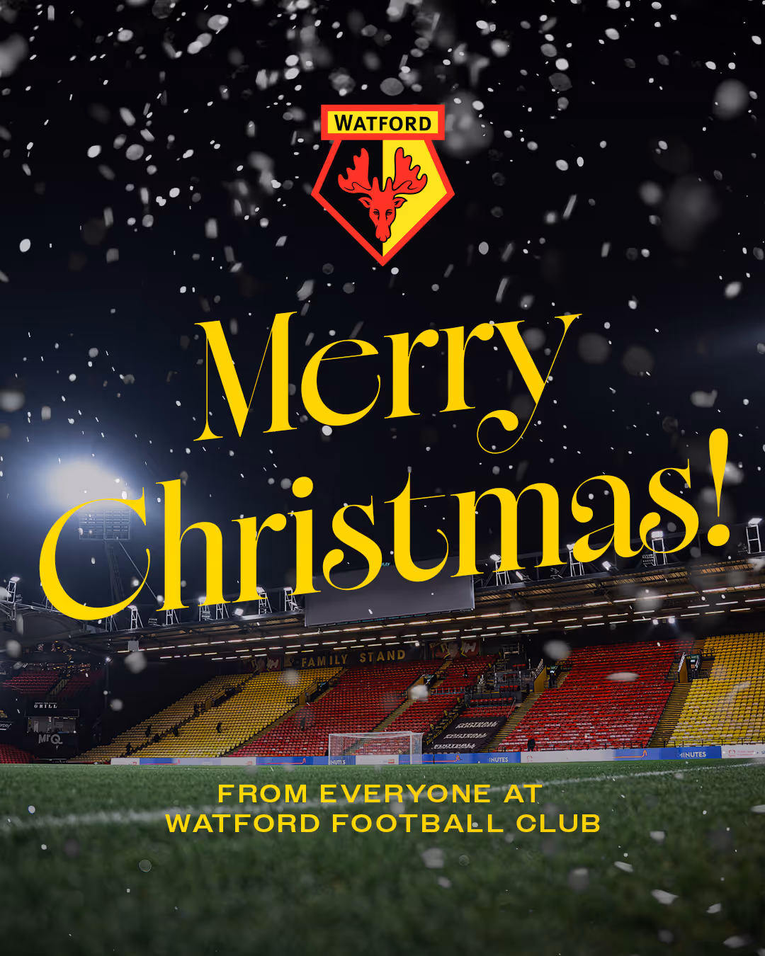 Vicarage Road stadium at night with snow falling and yellow text reading 'Merry Christmas! From everyone at Watford Football Club.'