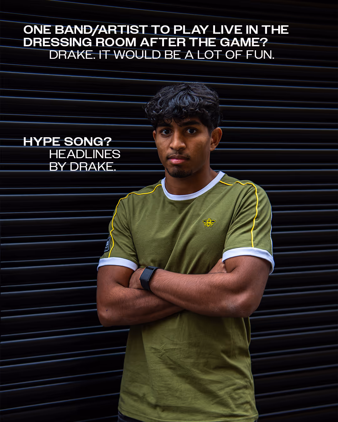 Amar Sanghrajka wearing a khaki green shirt with yellow detailing stands with folded arms against a dark corrugated background with text about Drake and a hype song.
