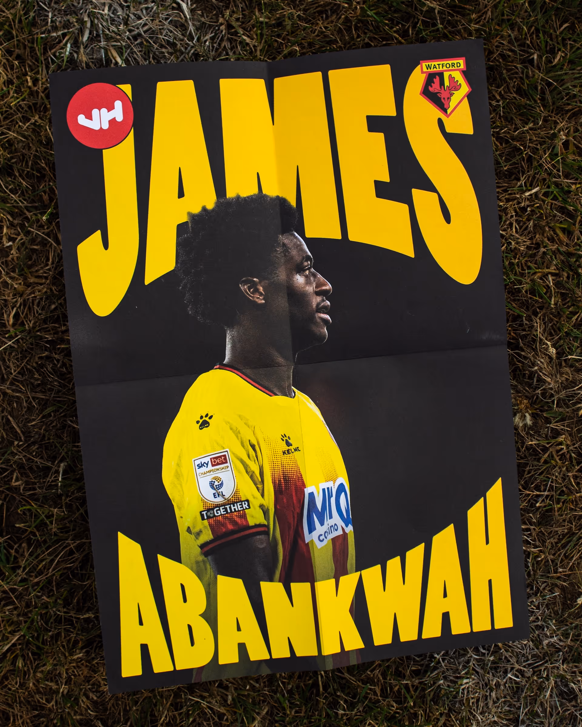 Poster of football player James Abankwah in yellow Watford jersey on grass background.