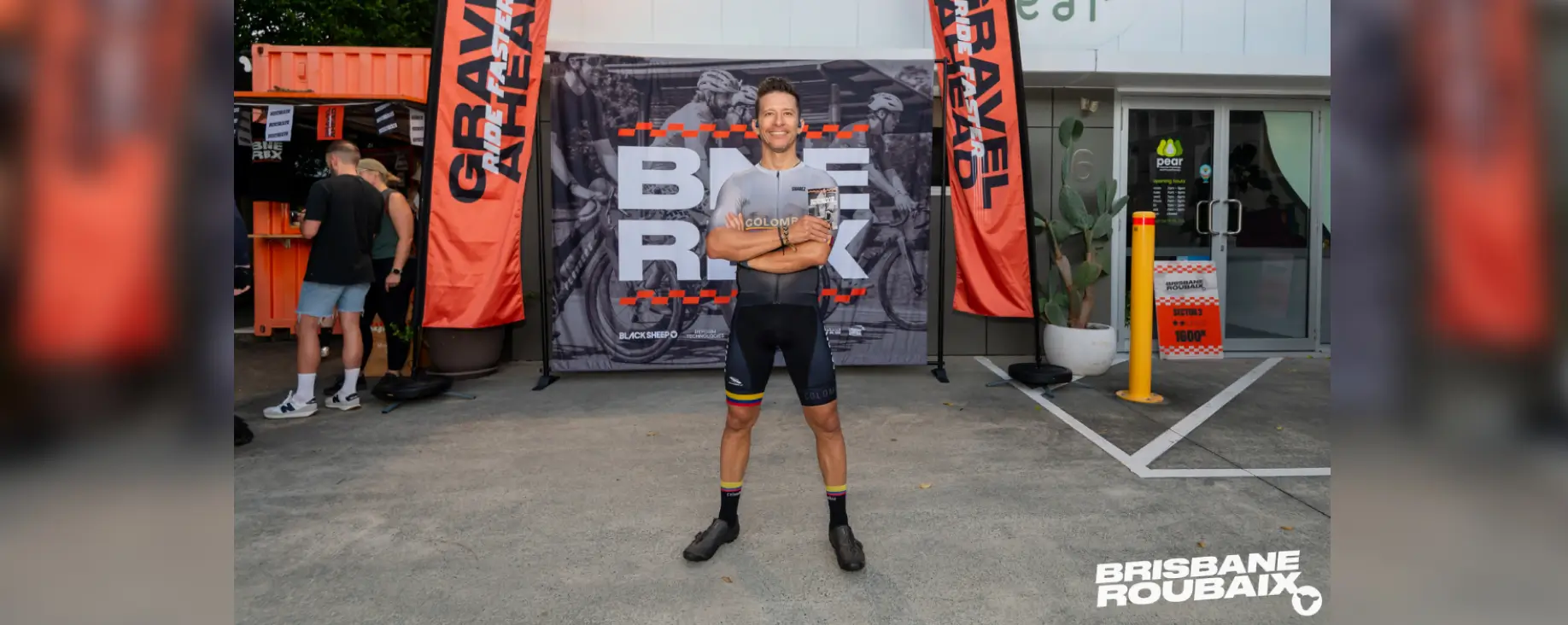 Cyclist posing at Brisbane Roubaix gravel race event entrance