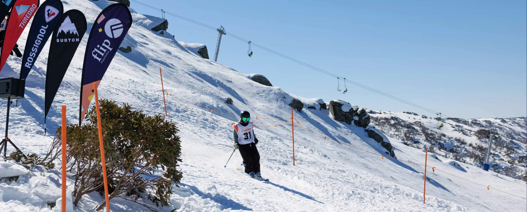 Skier on a snowy slope.