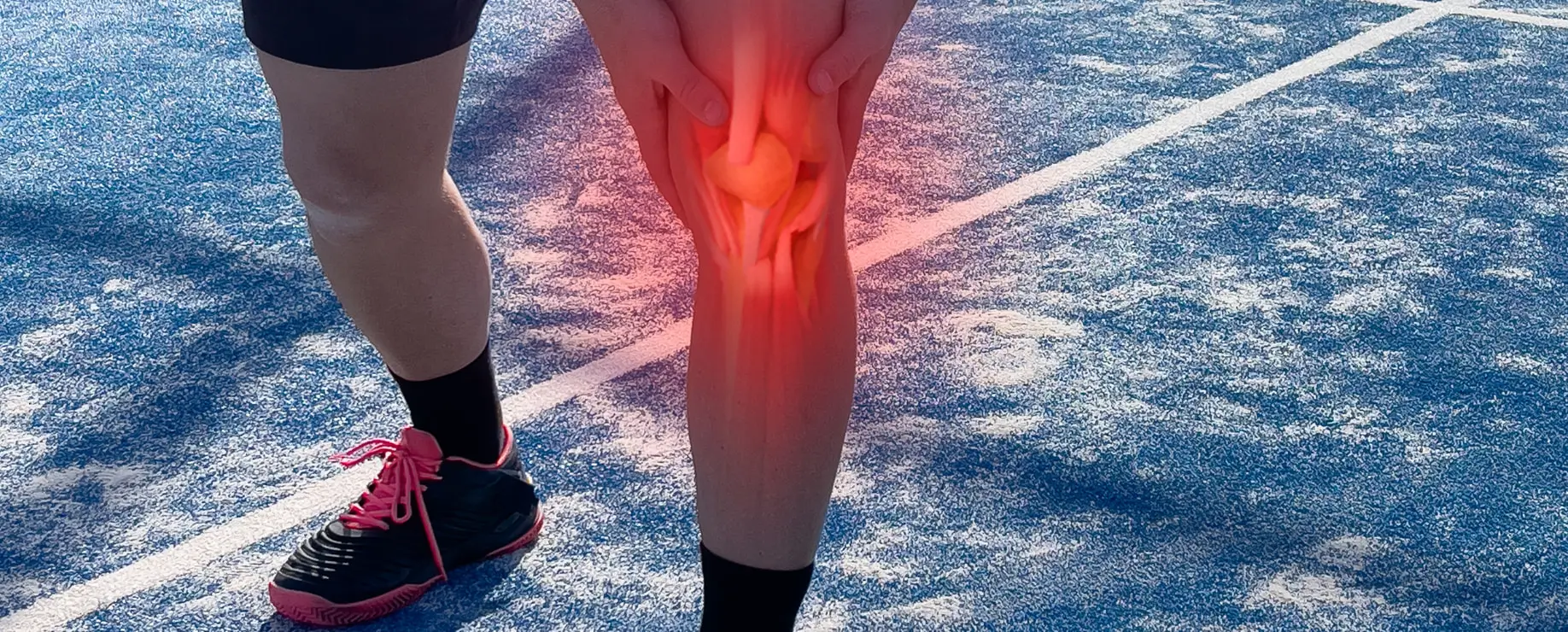 Runner holding knee in pain with red overlay indicating injury or inflammation