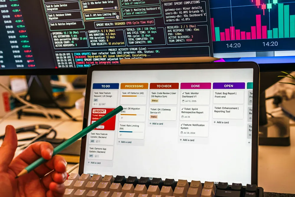 Pointing at a digital kanban board view on a tablet