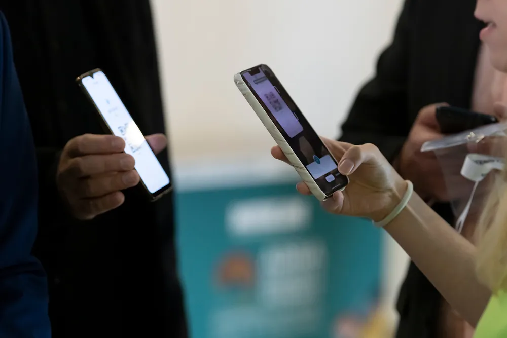Attendee registering for a business event on a smartphone using an online registration form