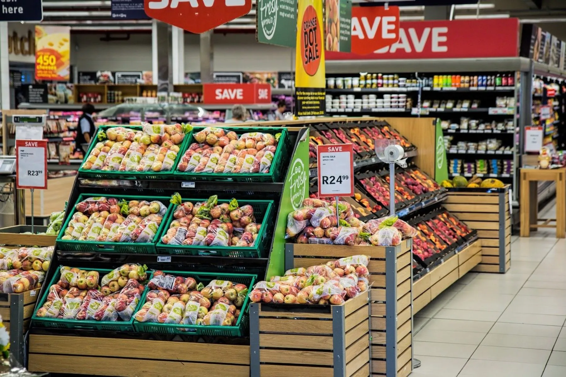 Photo of interior of grocery store showing fruit and other food products.