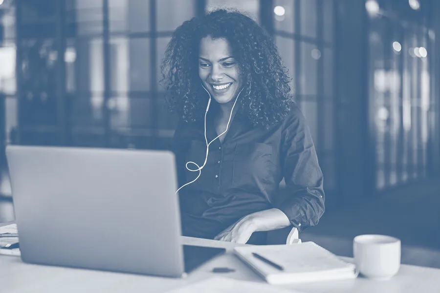 woman watching webinar on laptop computer