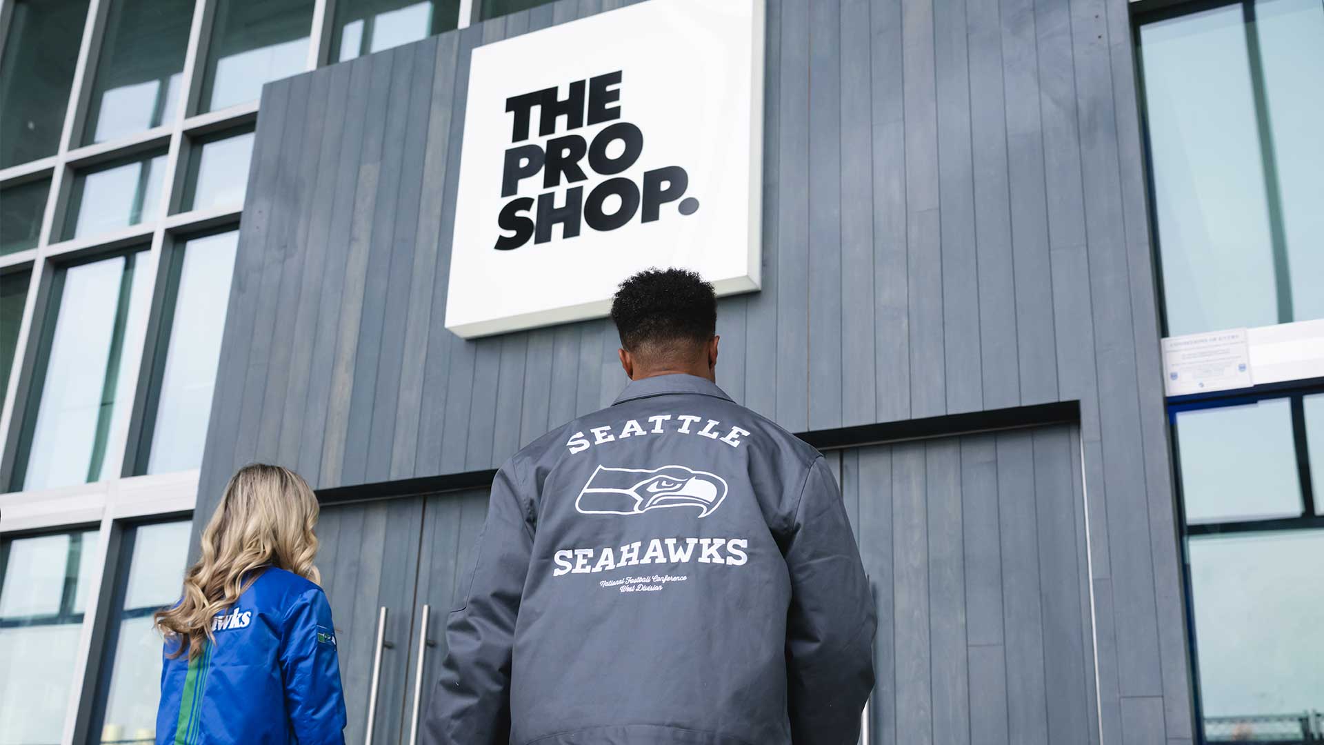 Fans wearing Seahawks apparel.
