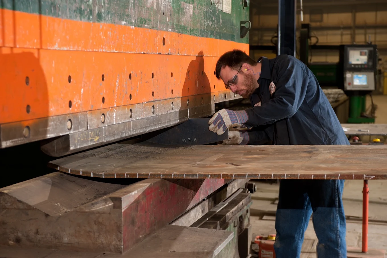A JADCO fabricator setting a plate at the press brake