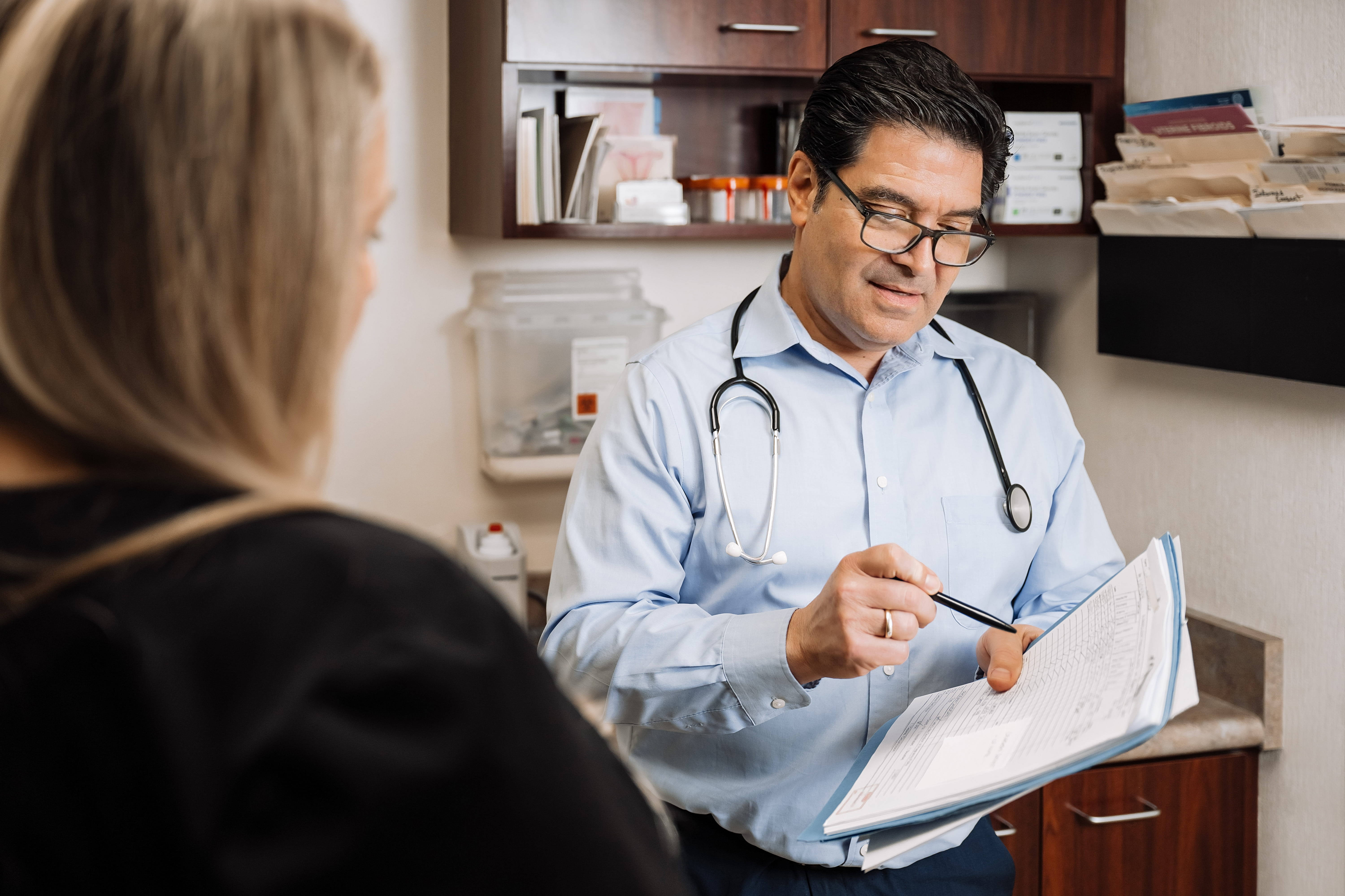 Patient talking with receptionist