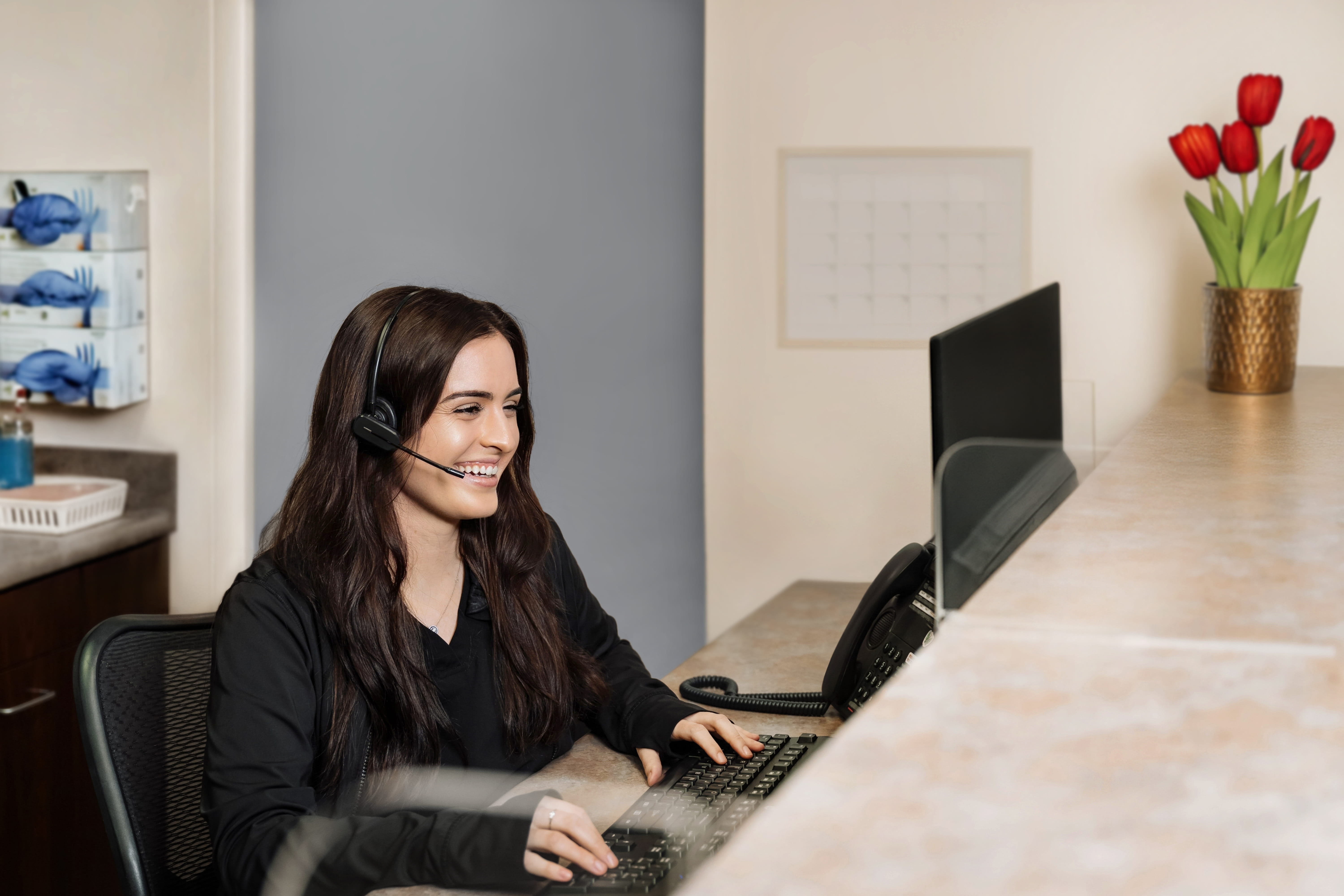 Patient talking with receptionist