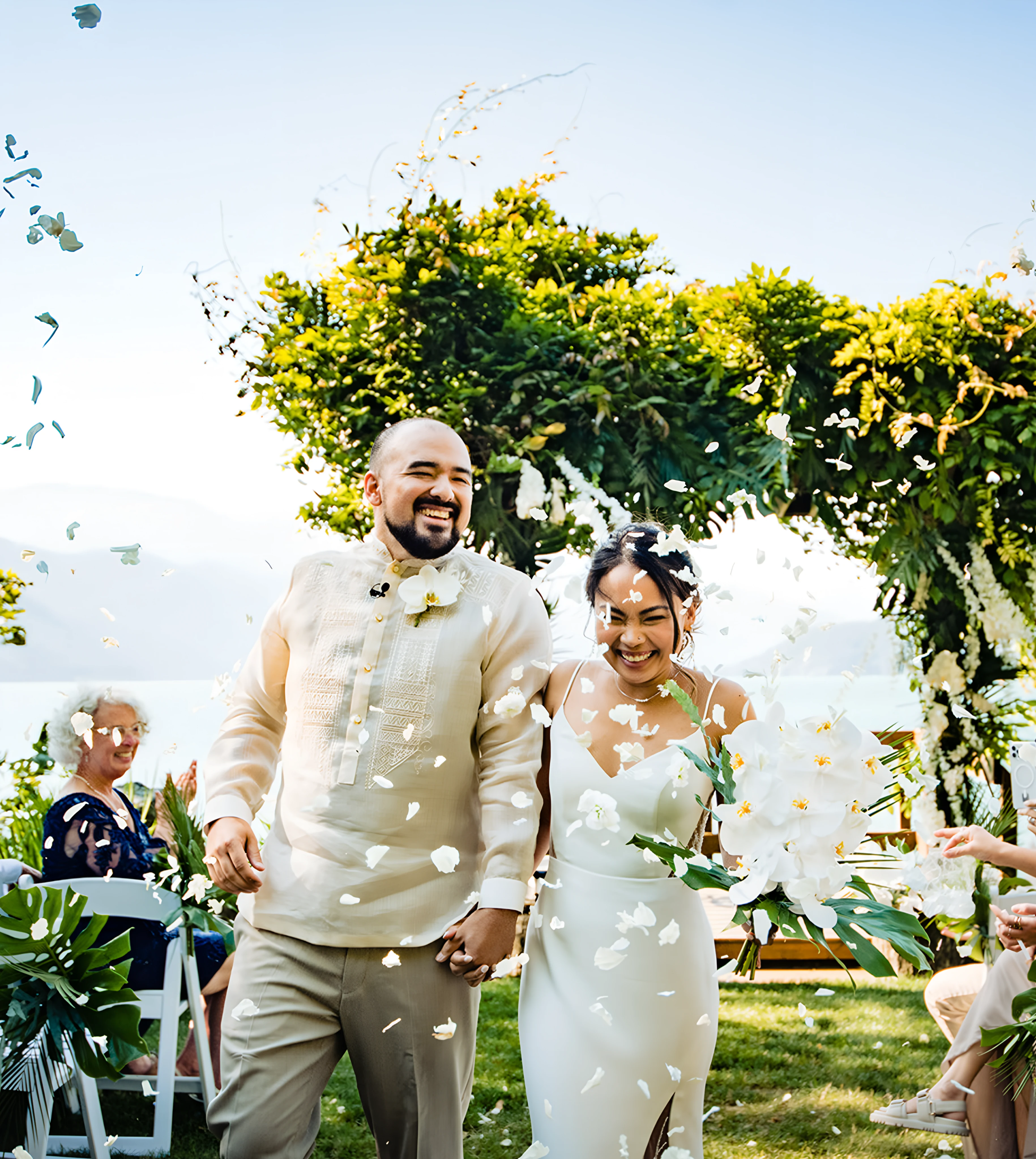 A newly married couple walking down the aisle.