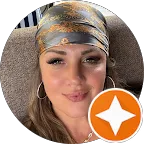 A woman with a bandana on her head.