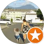 A woman and a child walking down a street.
