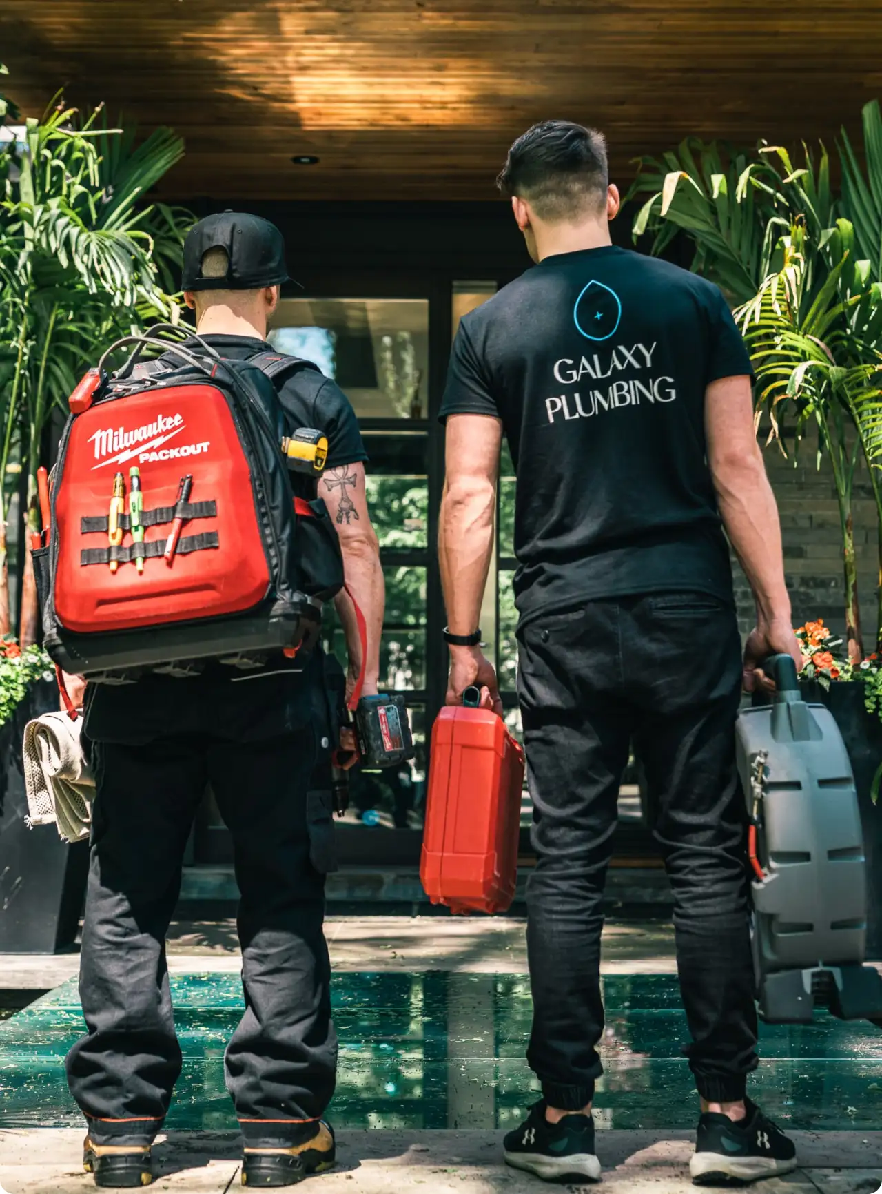 Technicians arriving with tools for home AC service