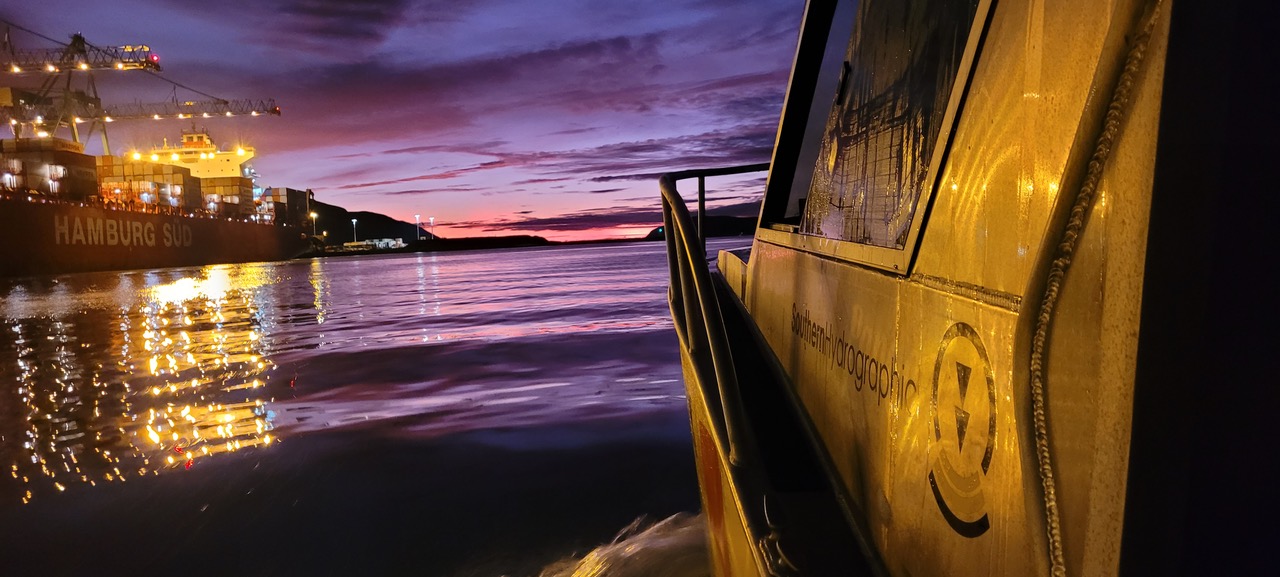 Boat looking out to sea at sunset