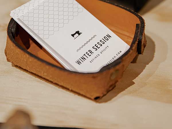 Business Card Design Brisbane with white minimal cards sitting in a wooden dish
