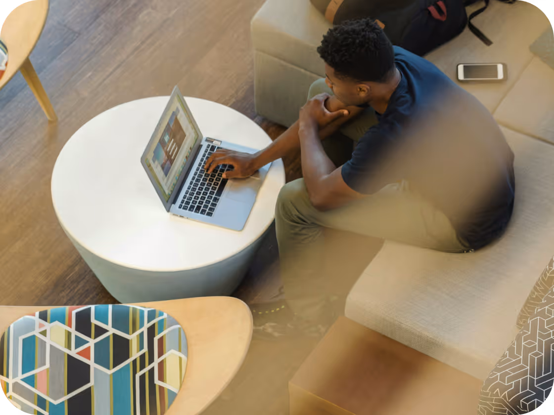 Person managing a retail store from a laptop