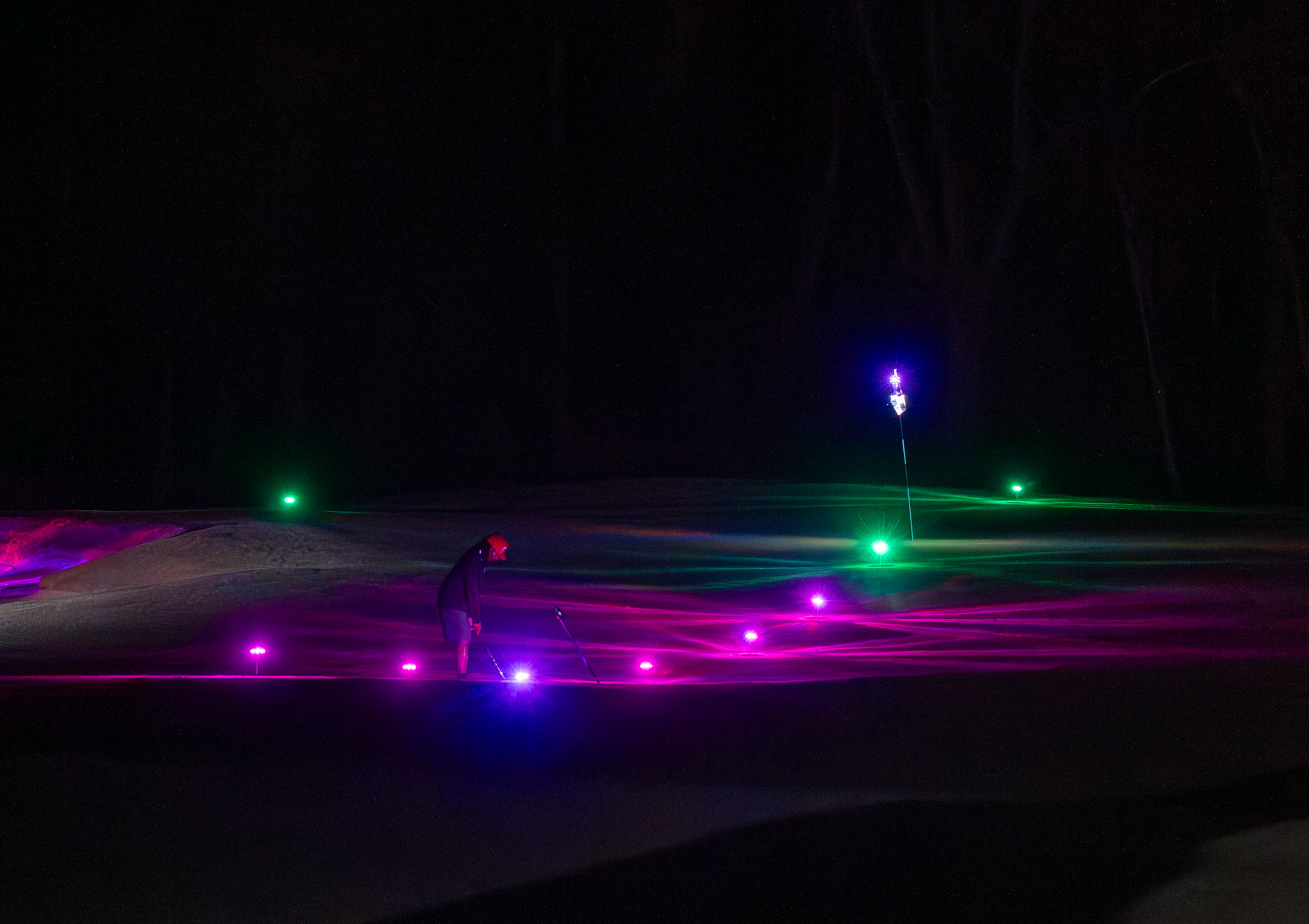 On-course glow golf at night