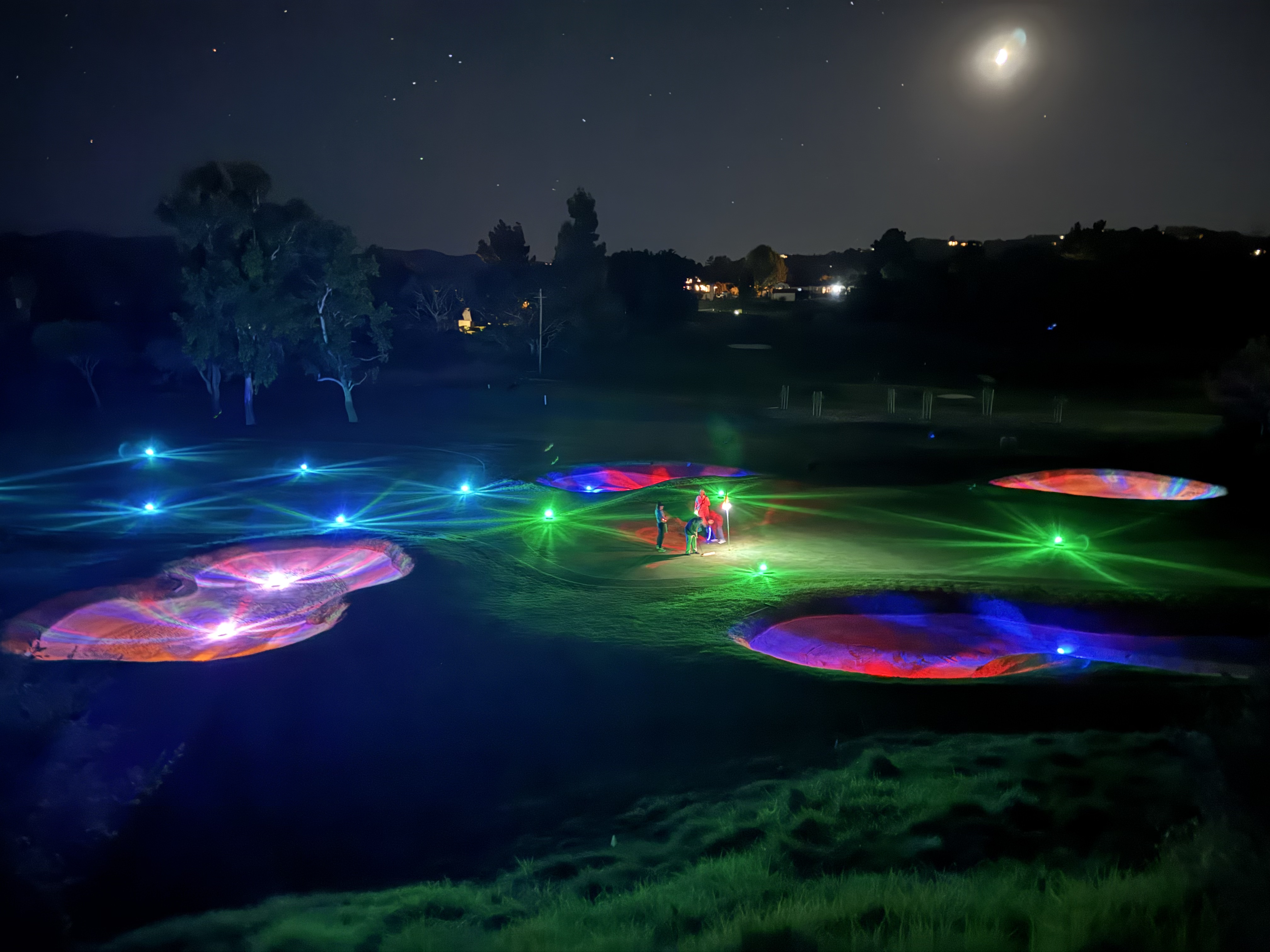 On-course glow golf at night