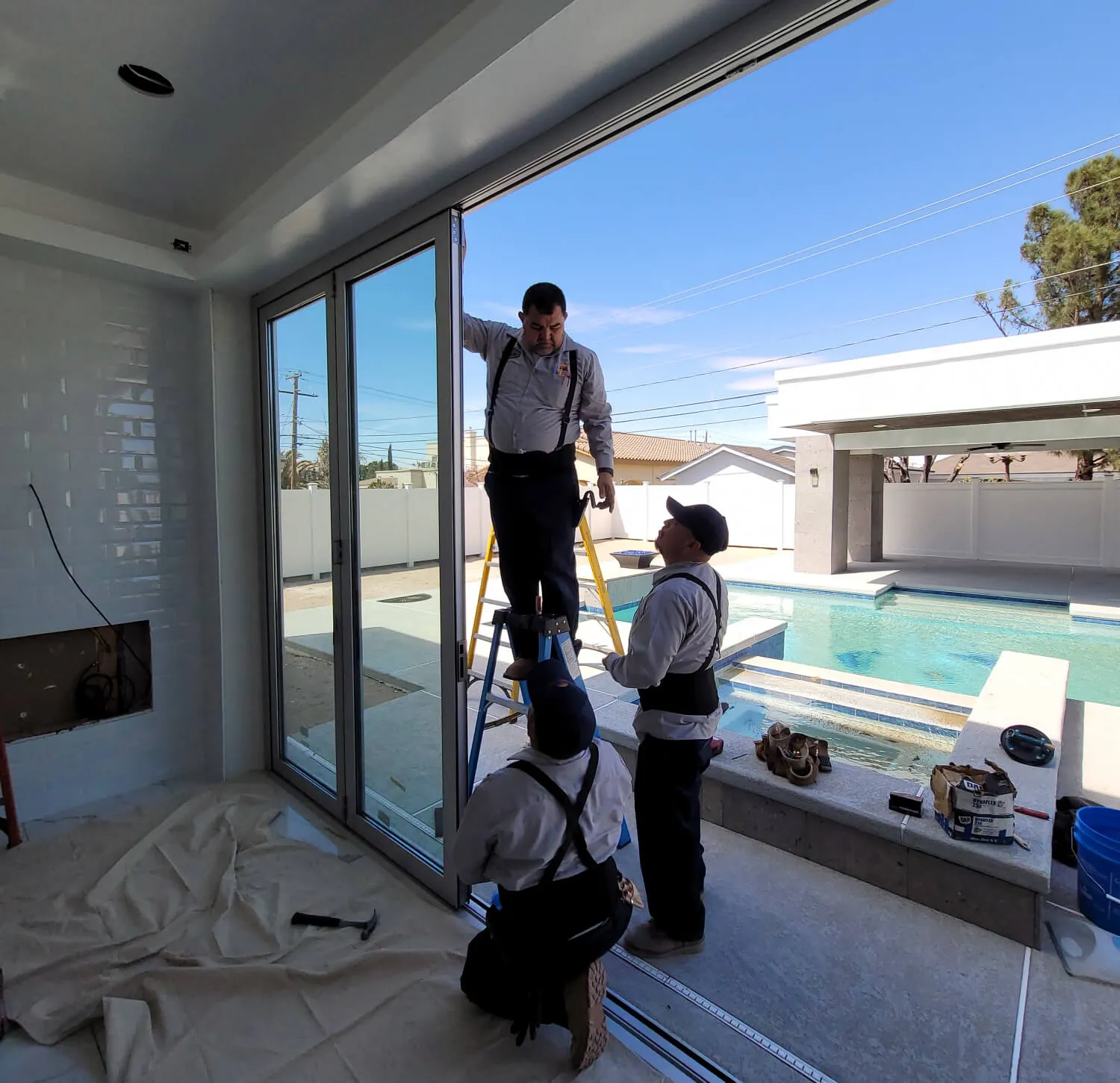 Southwestern Home Products' In-house install team working on custom glass doors