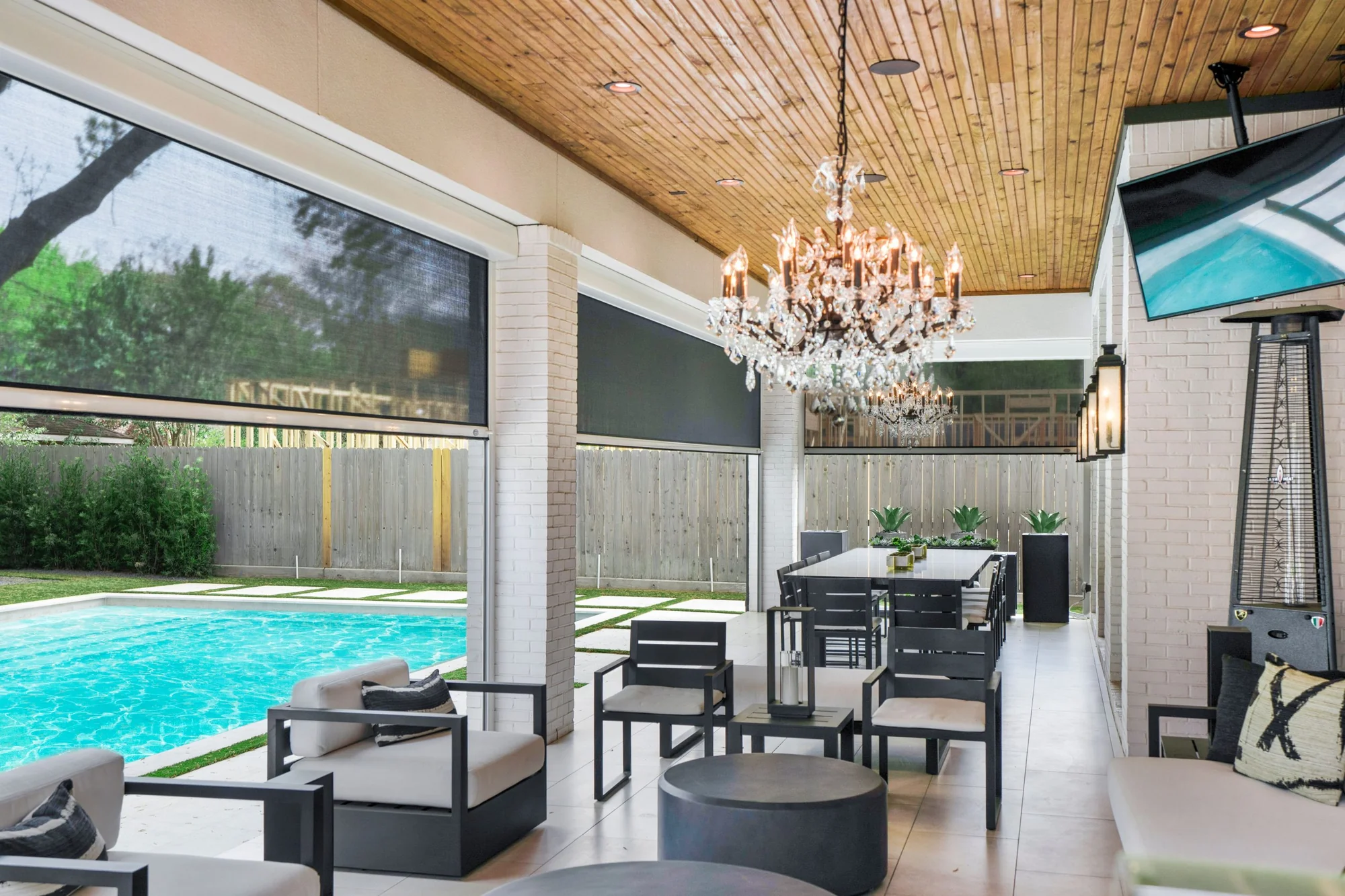 Motorized patio shade screens installed on residential outdoor space in Texas