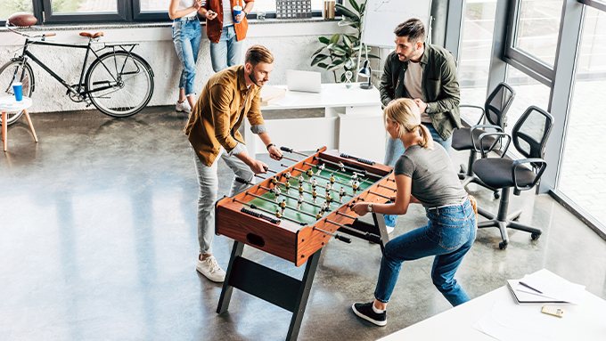 Playing foosball at the office