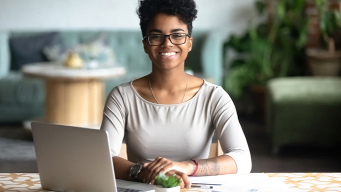 Happy woman invoicing