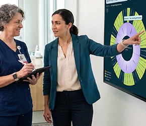 Nursing professionals engaging with digital curriculum tools and AI-assisted platforms in healthcare and academic settings, supporting program design and accreditation alignment.