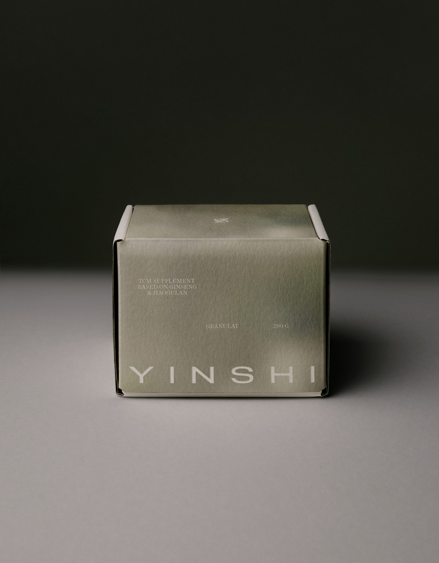 Minimalistisch inszenierte YINSHI-Verpackung für ein TCM-Supplement mit Ginseng und Jiaogulan.