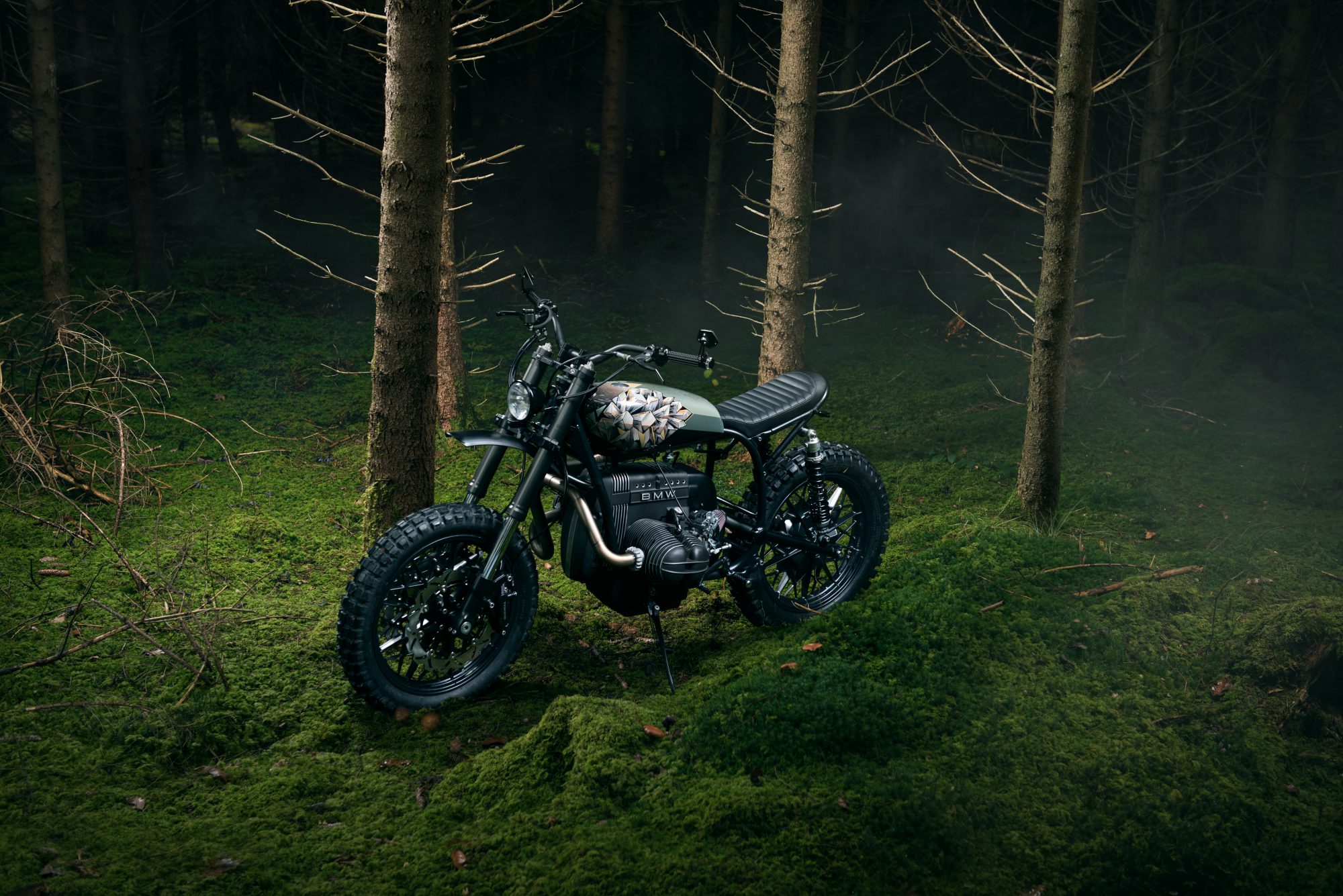 Diamond Atelier custom BMW motorcycle photographed in a forest
