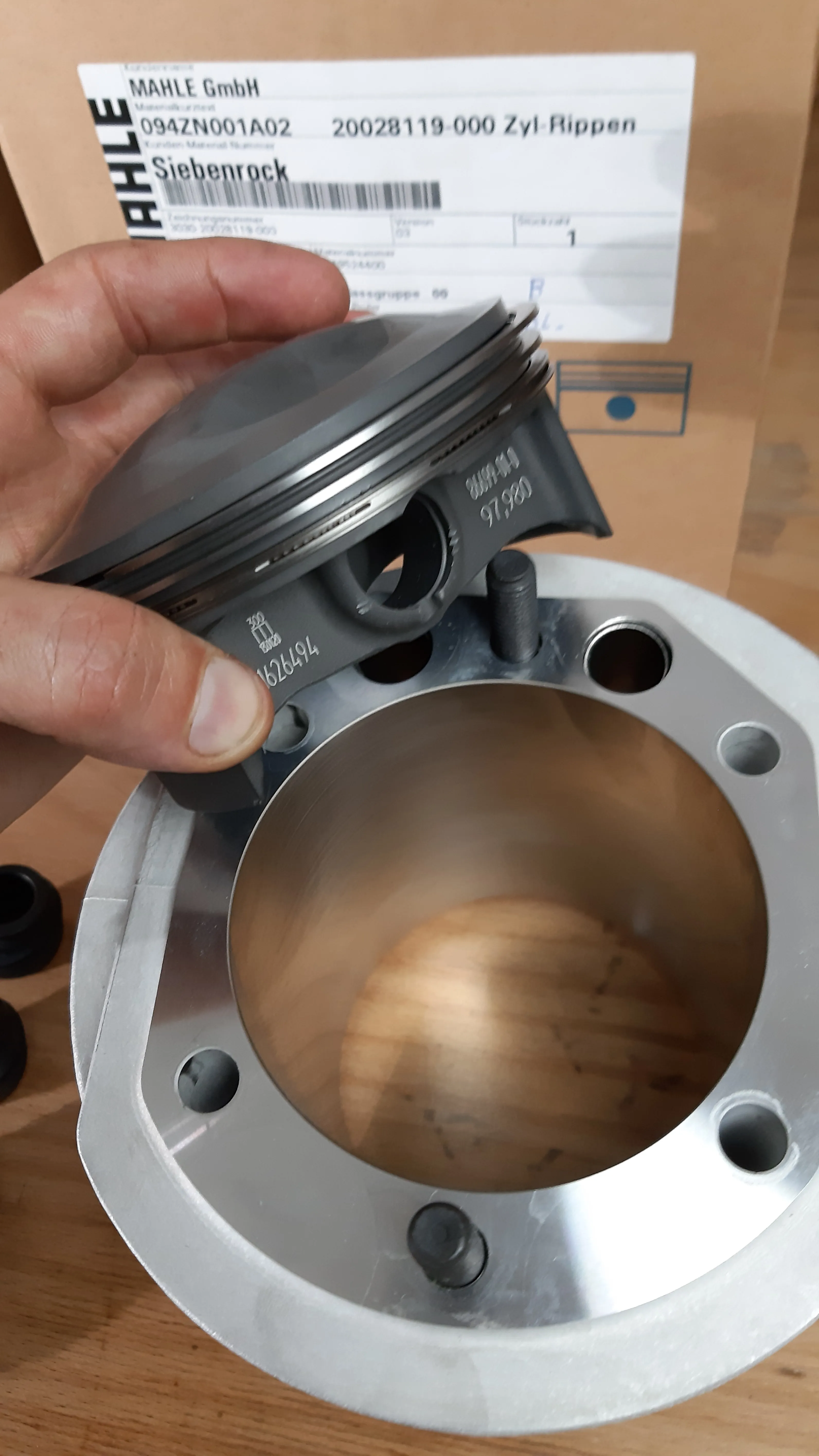 BMW Airhead piston and cylinder detail illustrating a piston-coating article