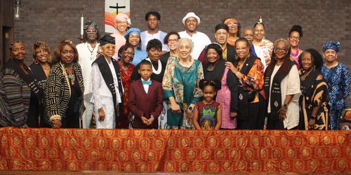 This is a photo of a few storytellers standing up and performing at one of our many wonderful shows.