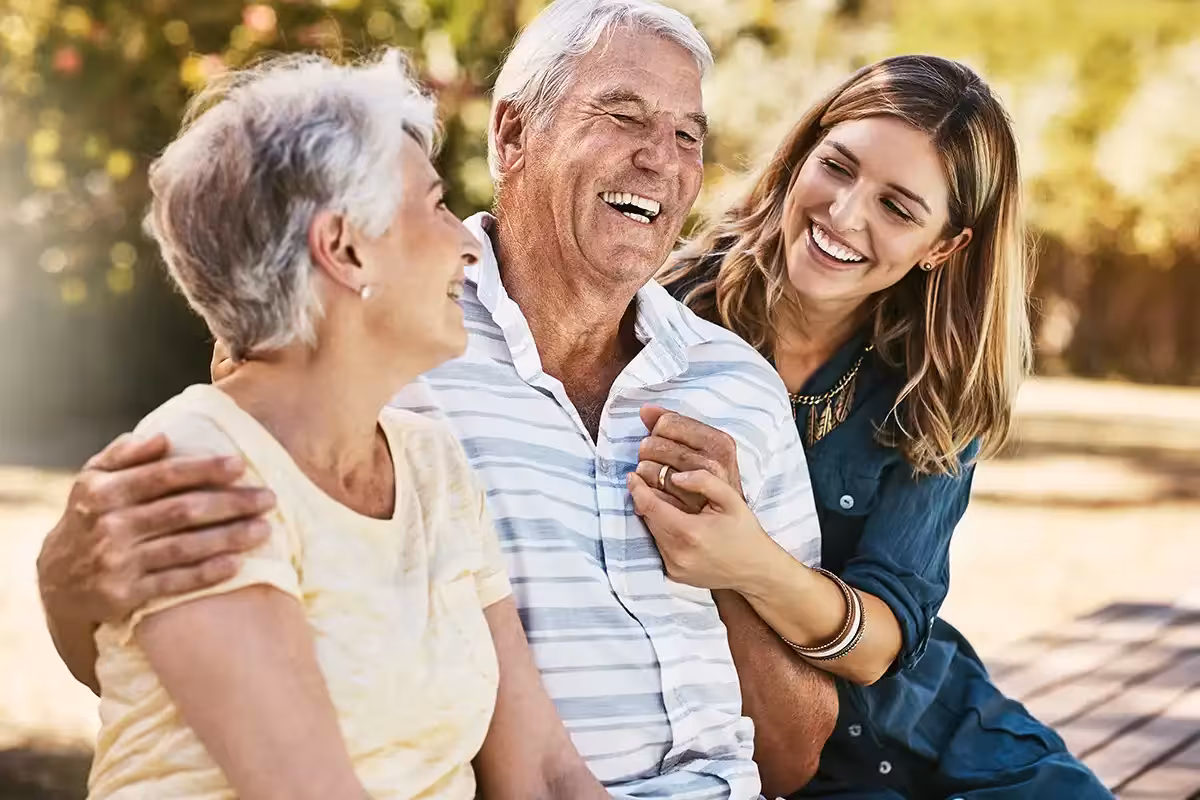 Woman, grandparents and hug for family summer vacation, holiday or break together in the outdoors. What Isn't Covered By Life Insurance? - 6 Common Exclusions