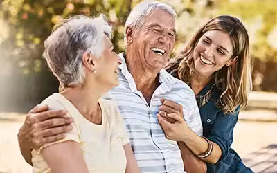 Woman, grandparents and hug for family summer vacation, holiday or break together in the outdoors. What Isn't Covered By Life Insurance? - 6 Common Exclusions