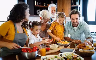 Cheerful family spending good time together while cooking in kitchen. What Is Level Term Life Insurance And How Does It Work?
