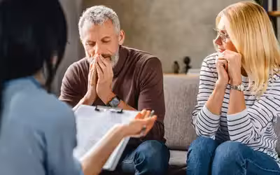 Couple concerned having received a diagnosis for a critical illness. What Is Critical Illness Cover And How Does It Work With Life Insurance?