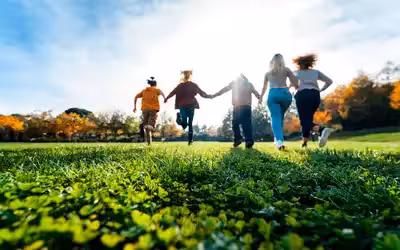 Family of five running in the park. 8 Different Types of Life Insurance.
