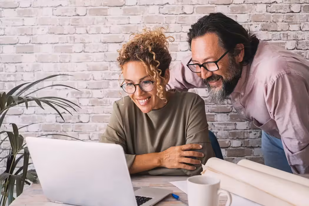 couple looking at computer screen at bupa's new health insurance 