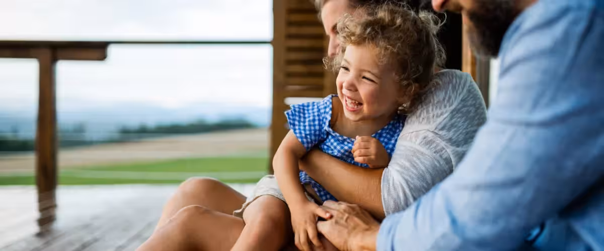 Smiling family with small daughter on holiday outside. What Are The Differences Between Health And Life Insurance?