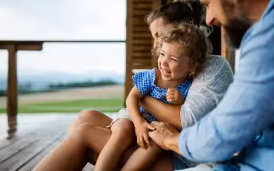 Smiling family with small daughter on holiday outside. What Are The Differences Between Health And Life Insurance?