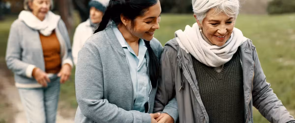 Nurse walking with patient outside. What Is An NHS Cash Benefit?