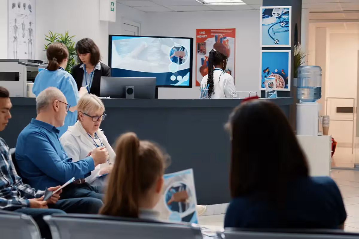Busy hospital reception with diverse group of patients in waiting room area