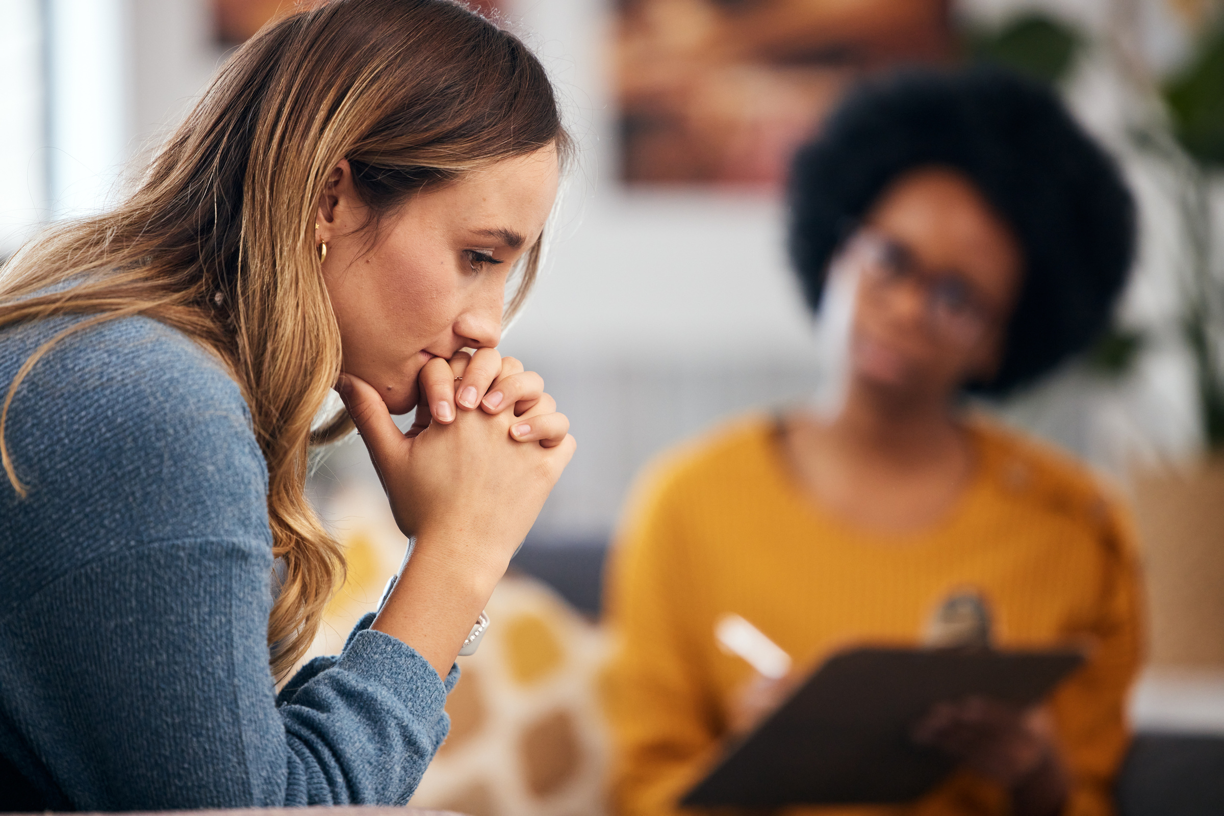 Mental health professional in conversation with a patient during a clinical session