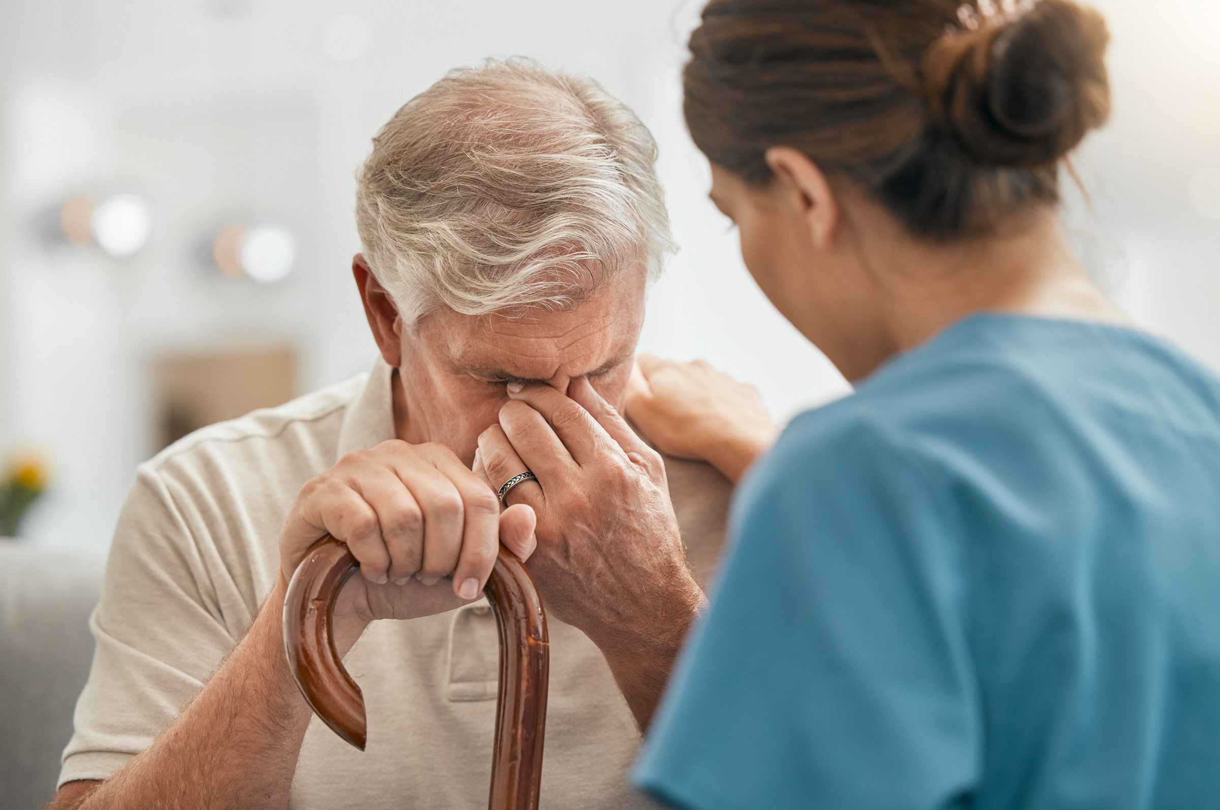 Patient holding an NHS appointment letter while reviewing private healthcare options