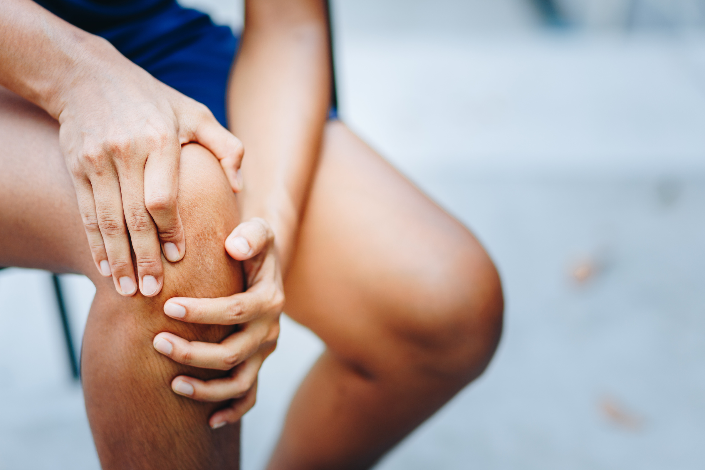 Physiotherapist supporting a patient after private knee replacement surgery in the UK