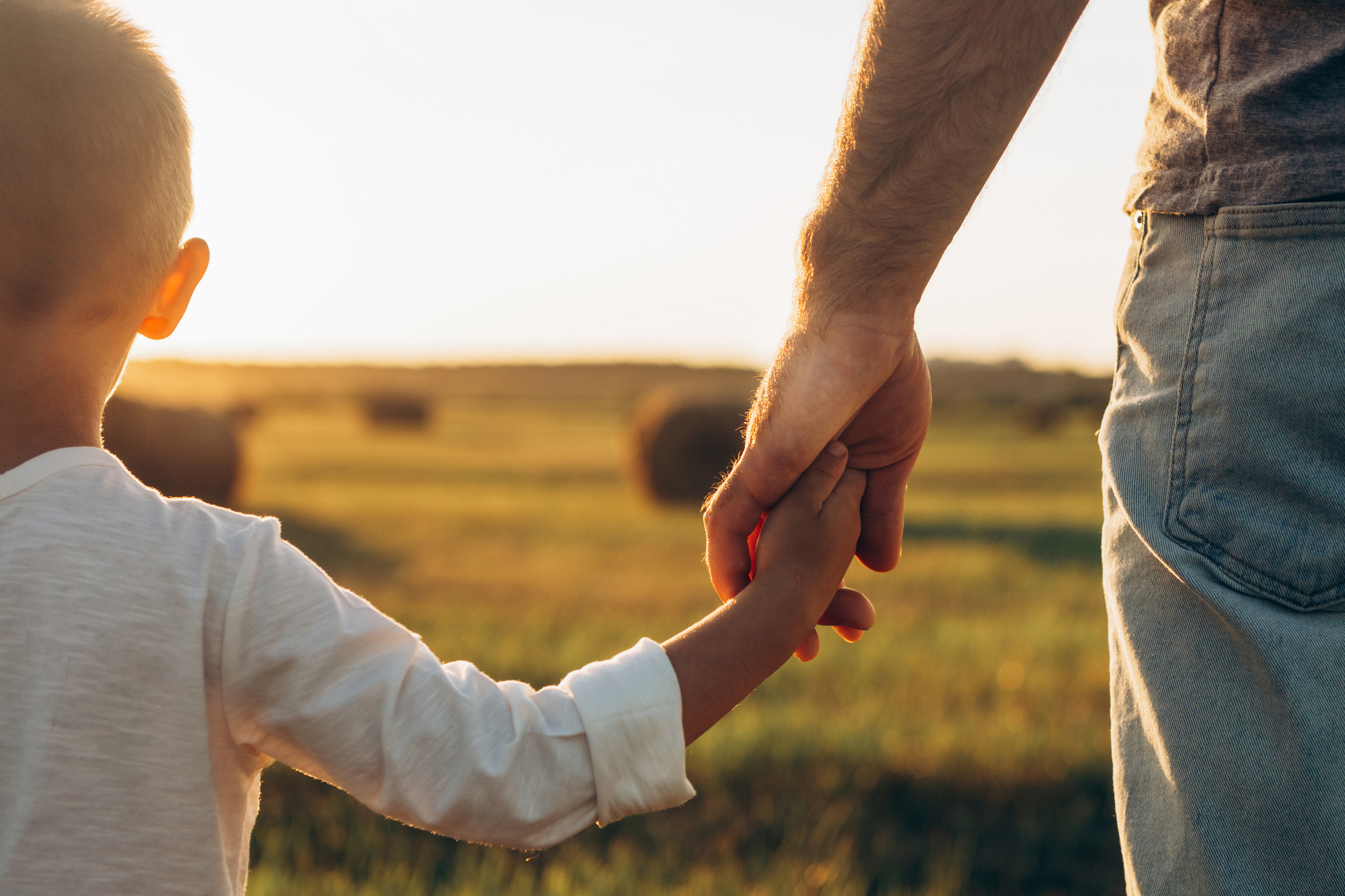 Single parent reviewing life insurance cover with their child at home