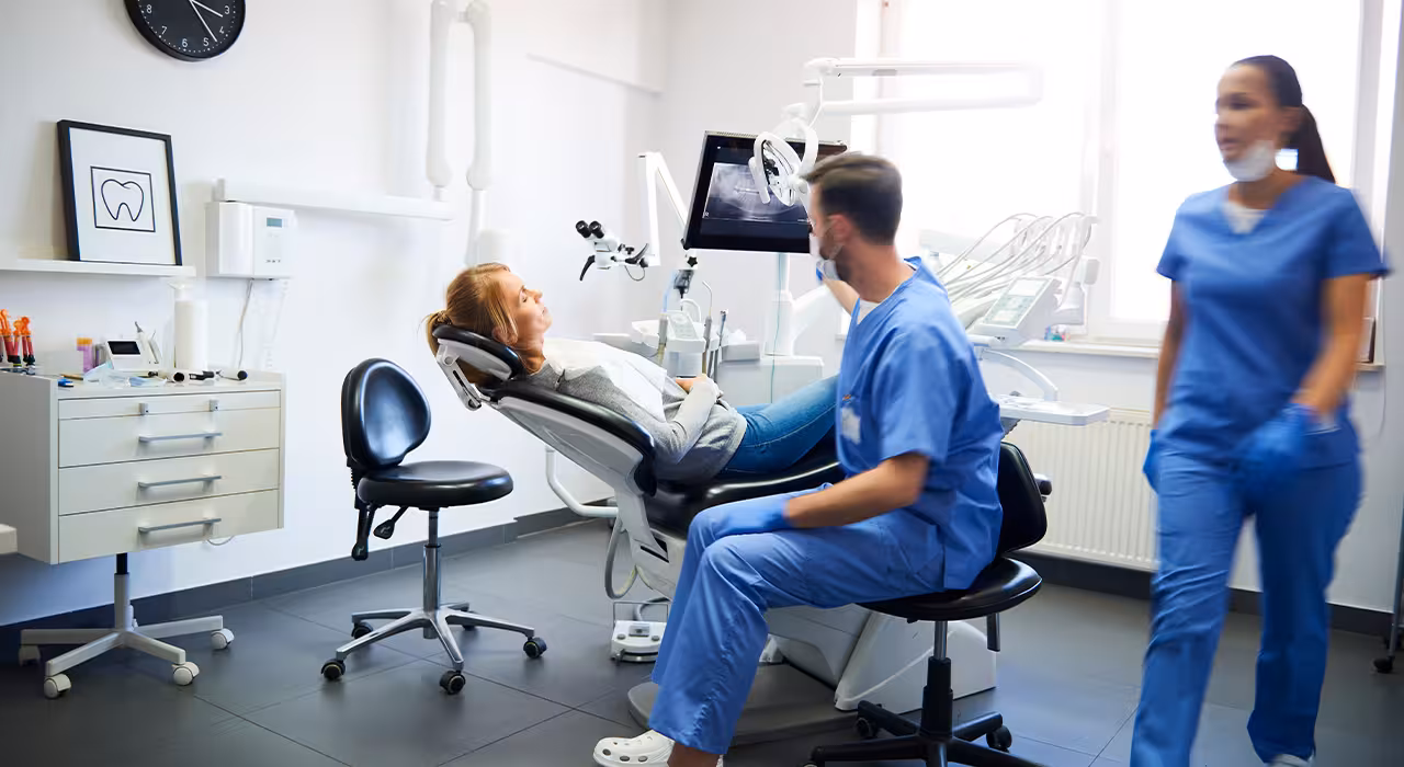 Dentist examining a patient in a modern dental surgery