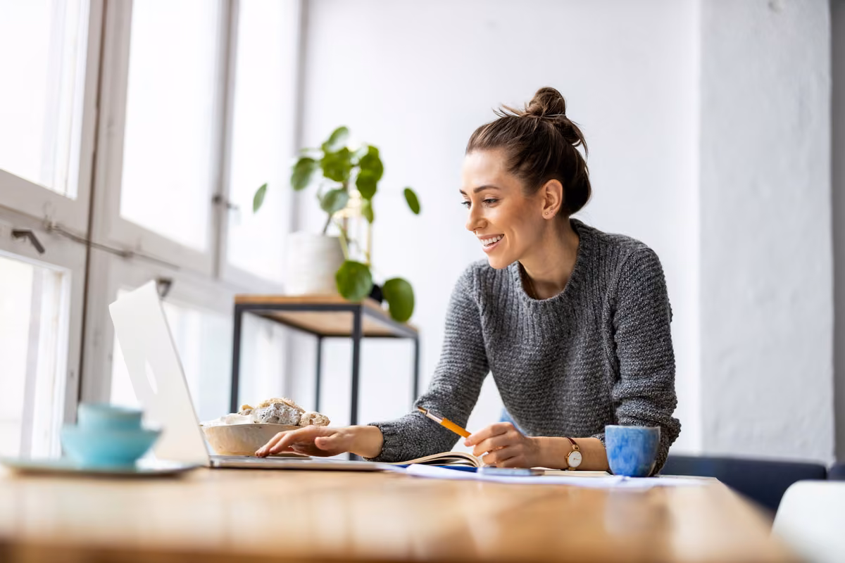 Person reviewing and updating their life insurance policy paperwork at home